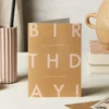 Katie Leamon | Tarjeta de Felicitación Eat Loads Of Cake